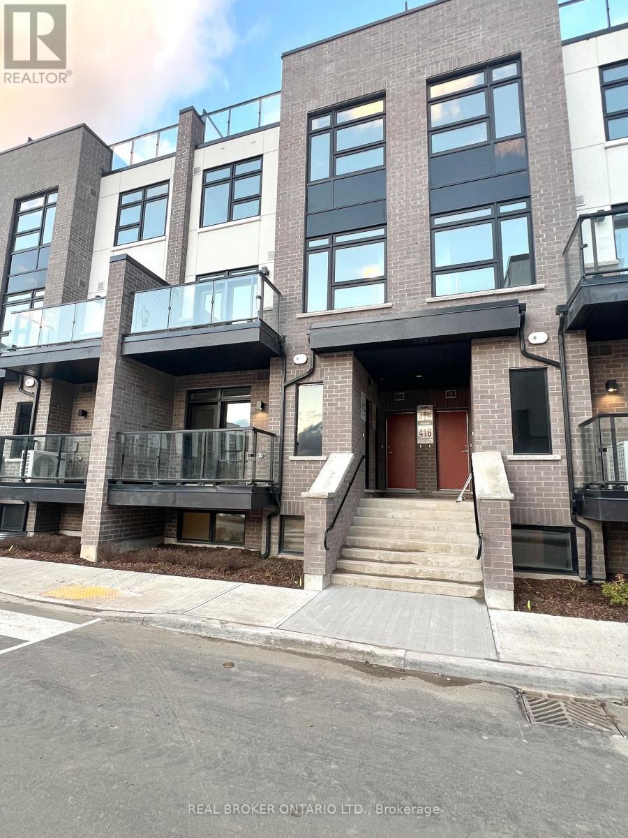 A building with a balcony and a door is shown.