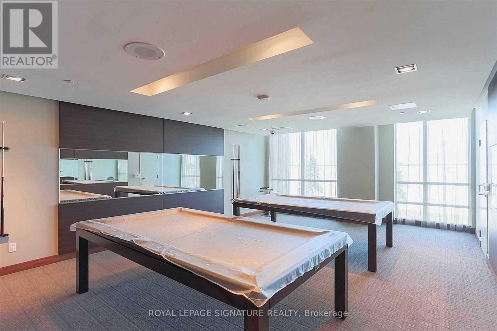 A bedroom with a bed in the middle of the room.
