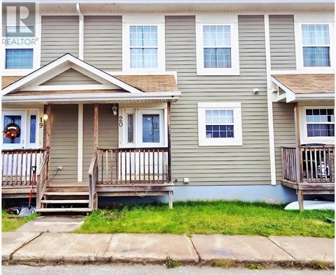 A two-story house with a balcony and a porch.