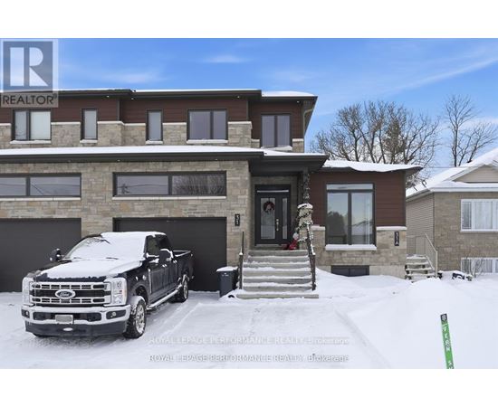 A large house with a truck parked in front.