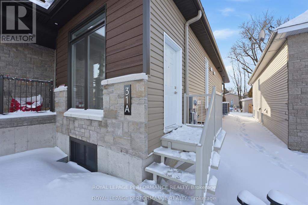 A house numbered 31A is shown in a snowy environment.