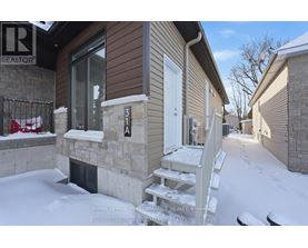 A house numbered 31A is shown in a snowy environment.