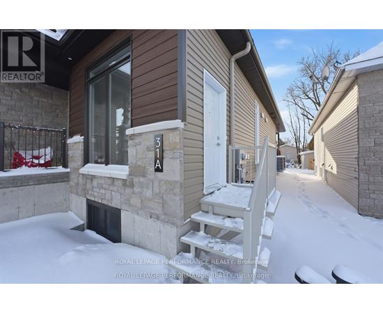 A house numbered 31A is shown in a snowy environment.