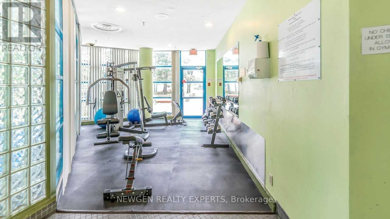 A gym with exercise equipment and a sign that says "No Smoking".