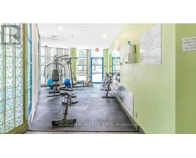 A gym with exercise equipment and a sign that says "No Smoking".