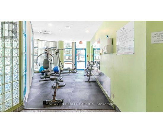 A gym with exercise equipment and a sign that says "No Smoking".