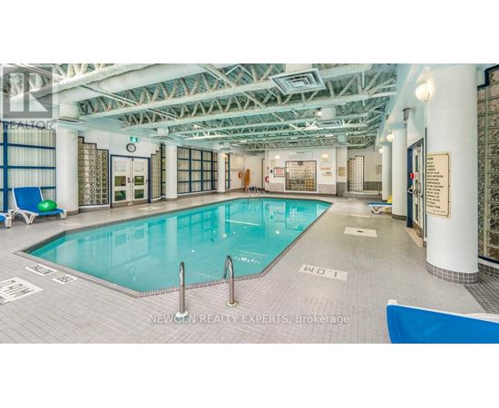 A large indoor swimming pool with a blue lane divider.
