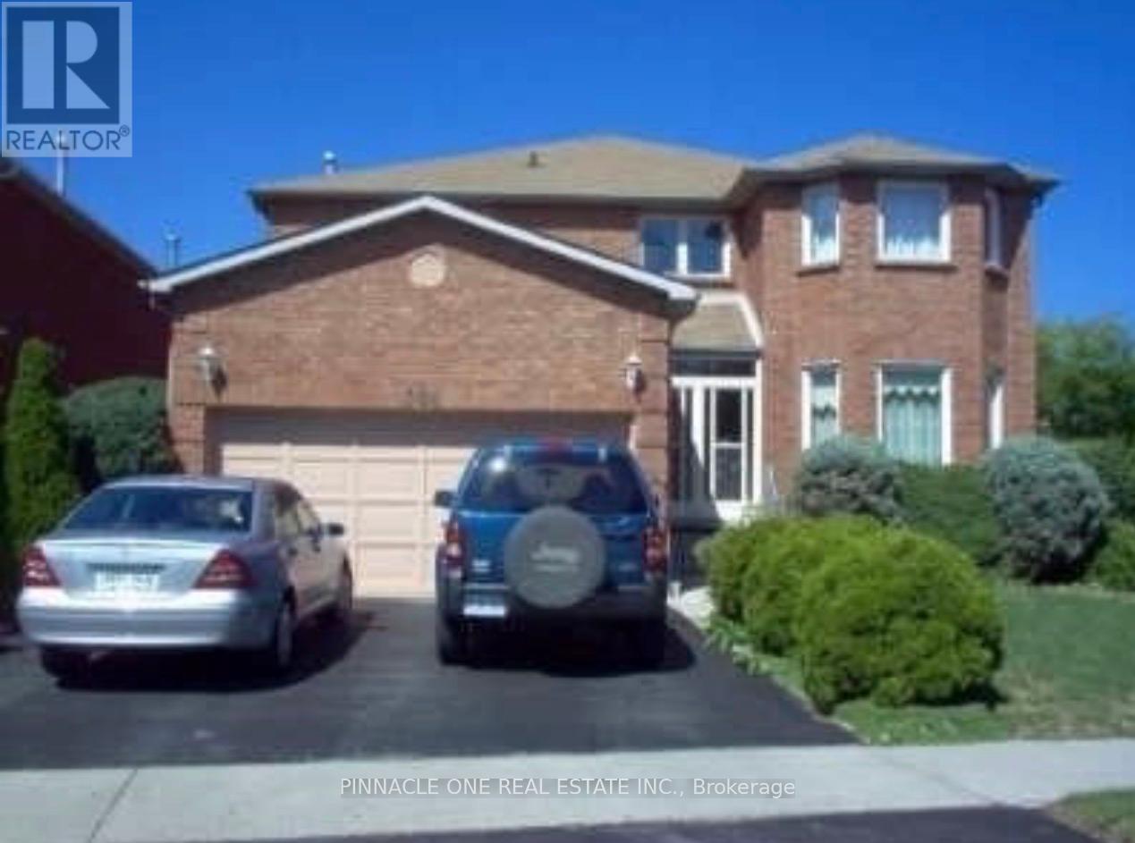 A house with a car parked in front of it.
