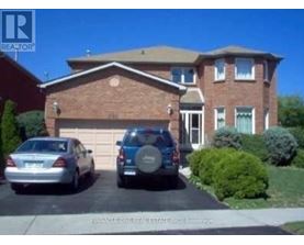 A house with a car parked in front of it.