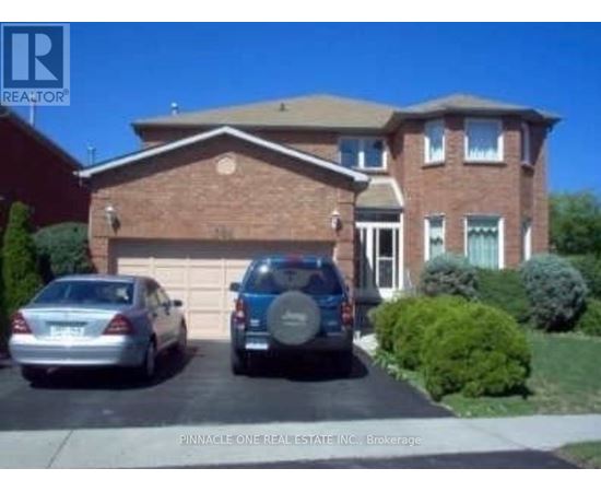 A house with a car parked in front of it.