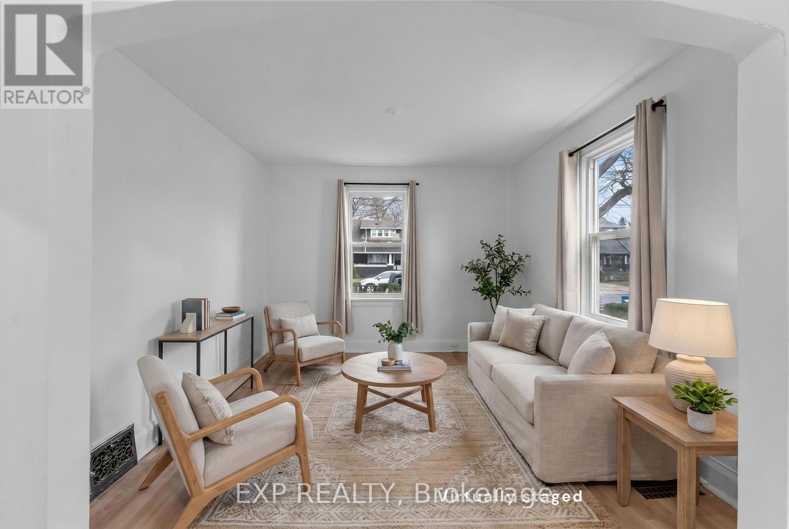 A living room with a couch, chair, and coffee table.