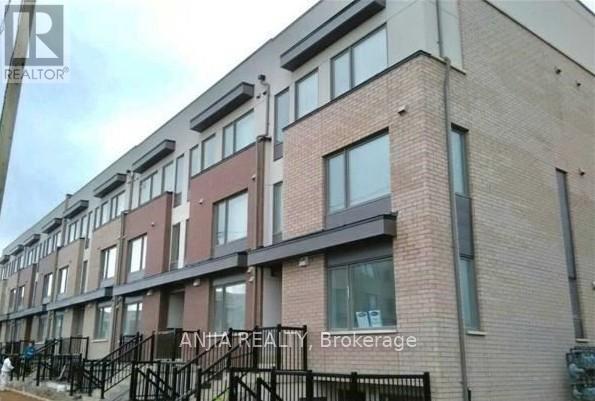 A building with the words ANTAREALTY, Brokerage on the fence.