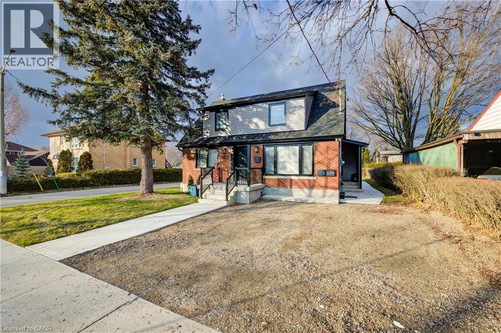 A house with a realtor sign in front of it.