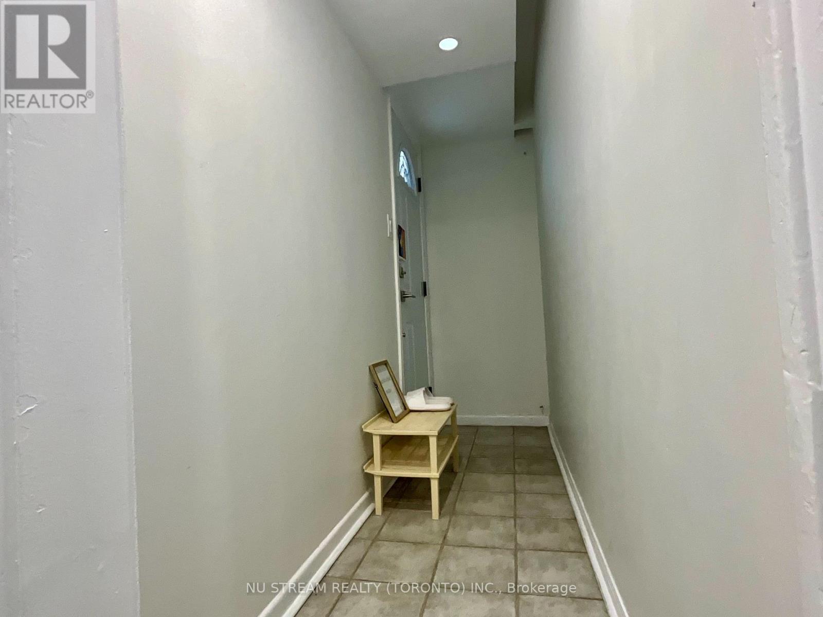 A small room with a table and a mirror.
