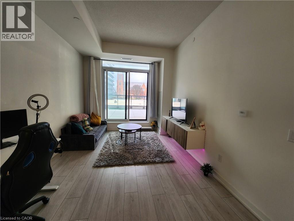 A living room with a black chair and a small table.
