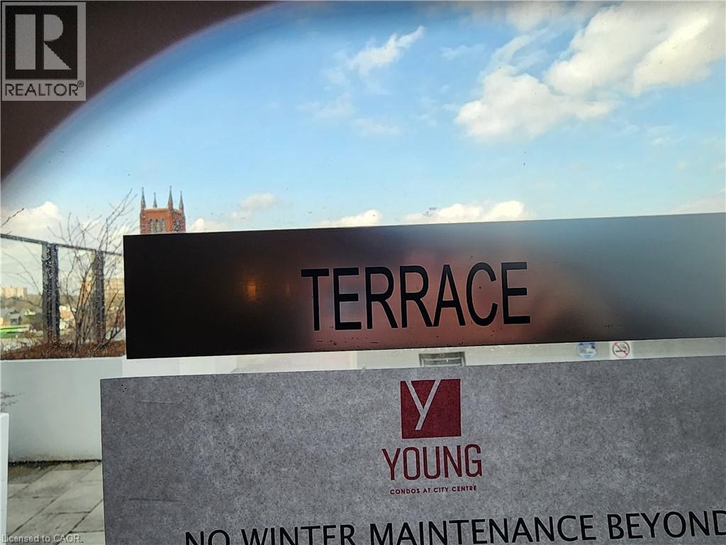 A sign that says Terrace in front of a building.