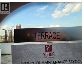 A sign that says Terrace in front of a building.