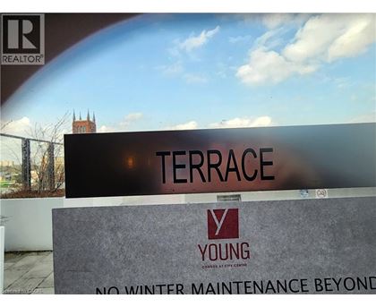A sign that says Terrace in front of a building.
