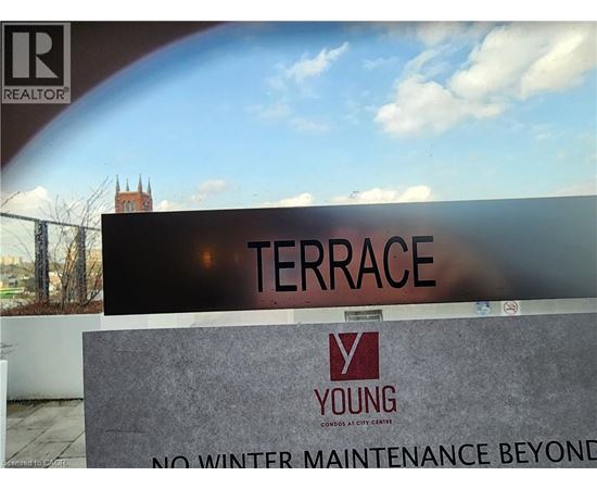 A sign that says Terrace in front of a building.