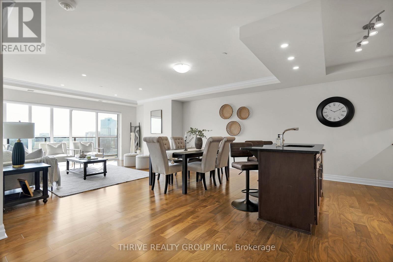 A well-lit, modern dining room with a large table and chairs.