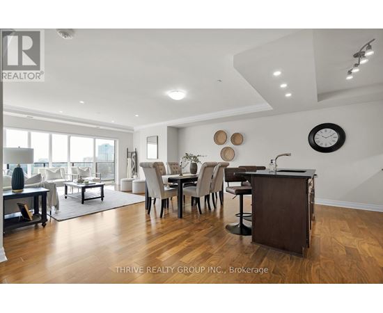 A well-lit, modern dining room with a large table and chairs.
