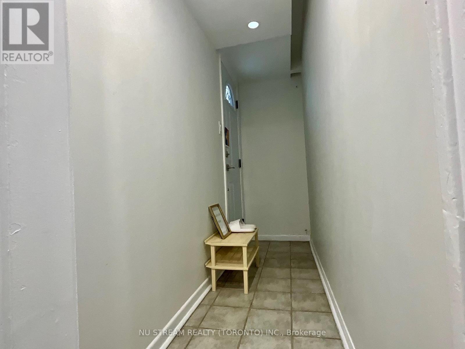 A small room with a table and a chair.