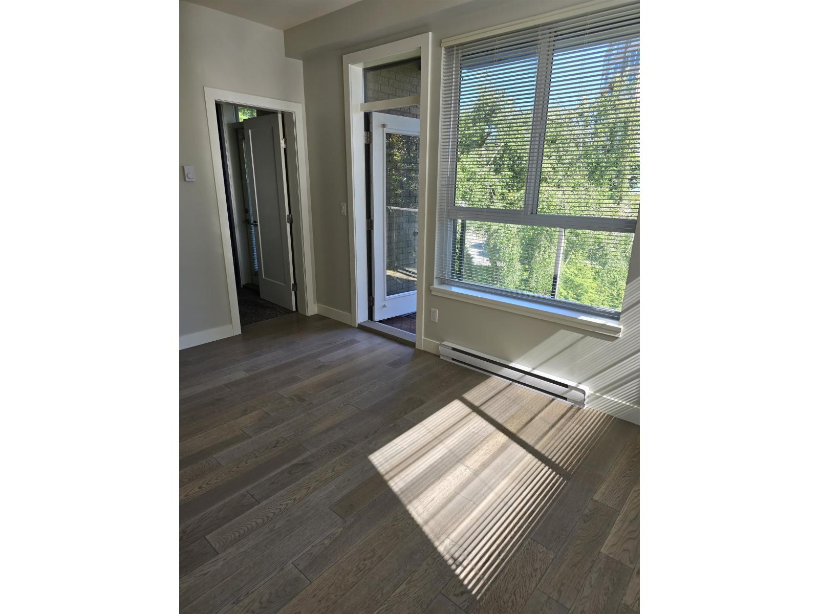 A room with a sliding door and a window.