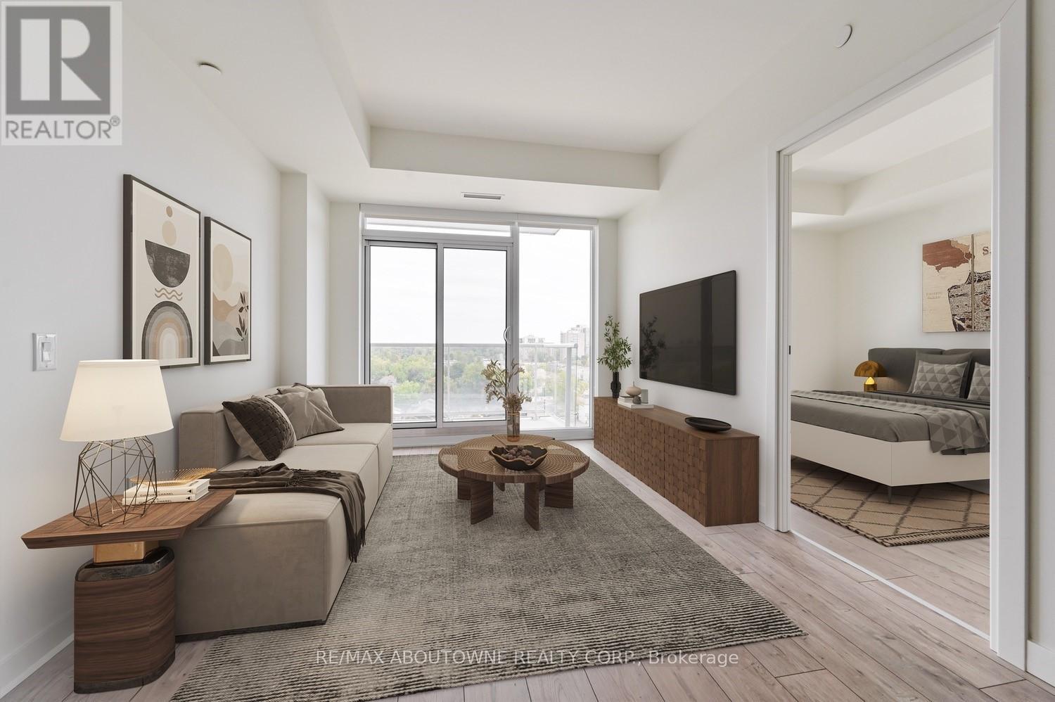 A modern living room with a grey sofa and a wooden coffee table.