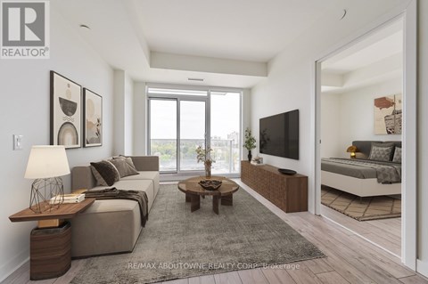 A modern living room with a grey sofa and a wooden coffee table.
