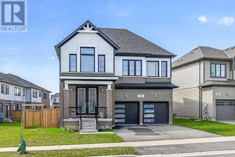 A modern two-story house with a garage is for sale.