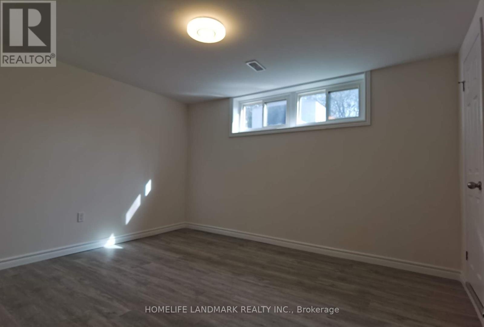 A room with a window and a door is shown.