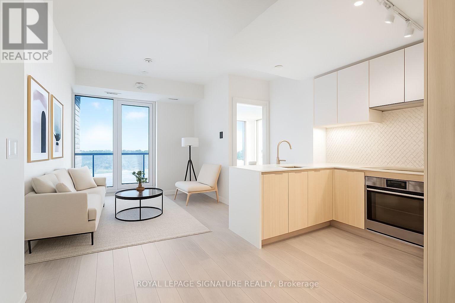 A modern kitchen with wooden cabinets and a stainless steel oven.