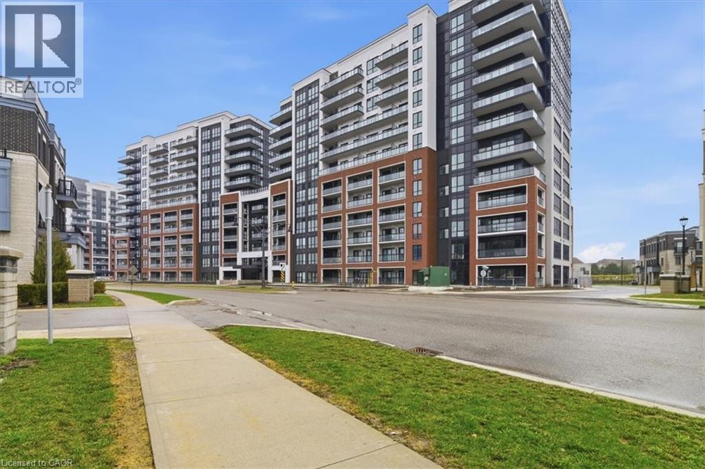 A large apartment complex with a walkway in front.
