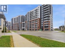 A large apartment complex with a walkway in front.