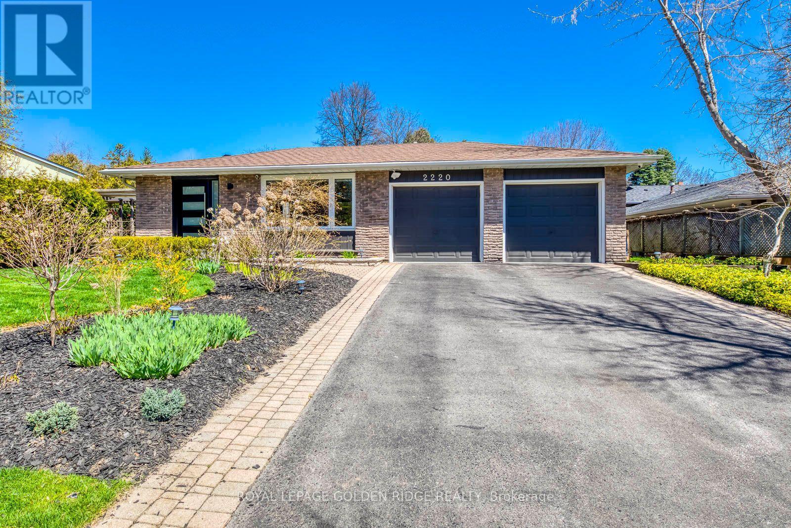 A house with a driveway and a garage door.