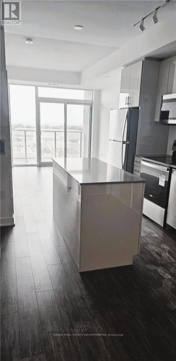A modern kitchen with a large island in the middle.