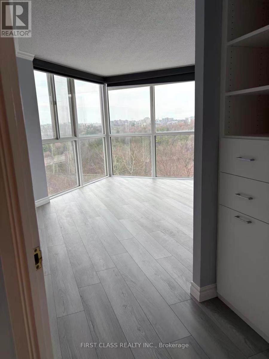 A room with a view of the outdoors through large windows.