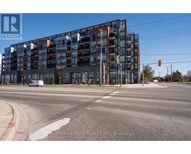 A modern multi-story building with a glass facade is the main focus of the image.