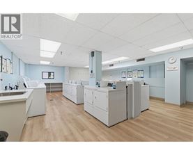 A clean, well-lit office space with a realtor logo on the wall.