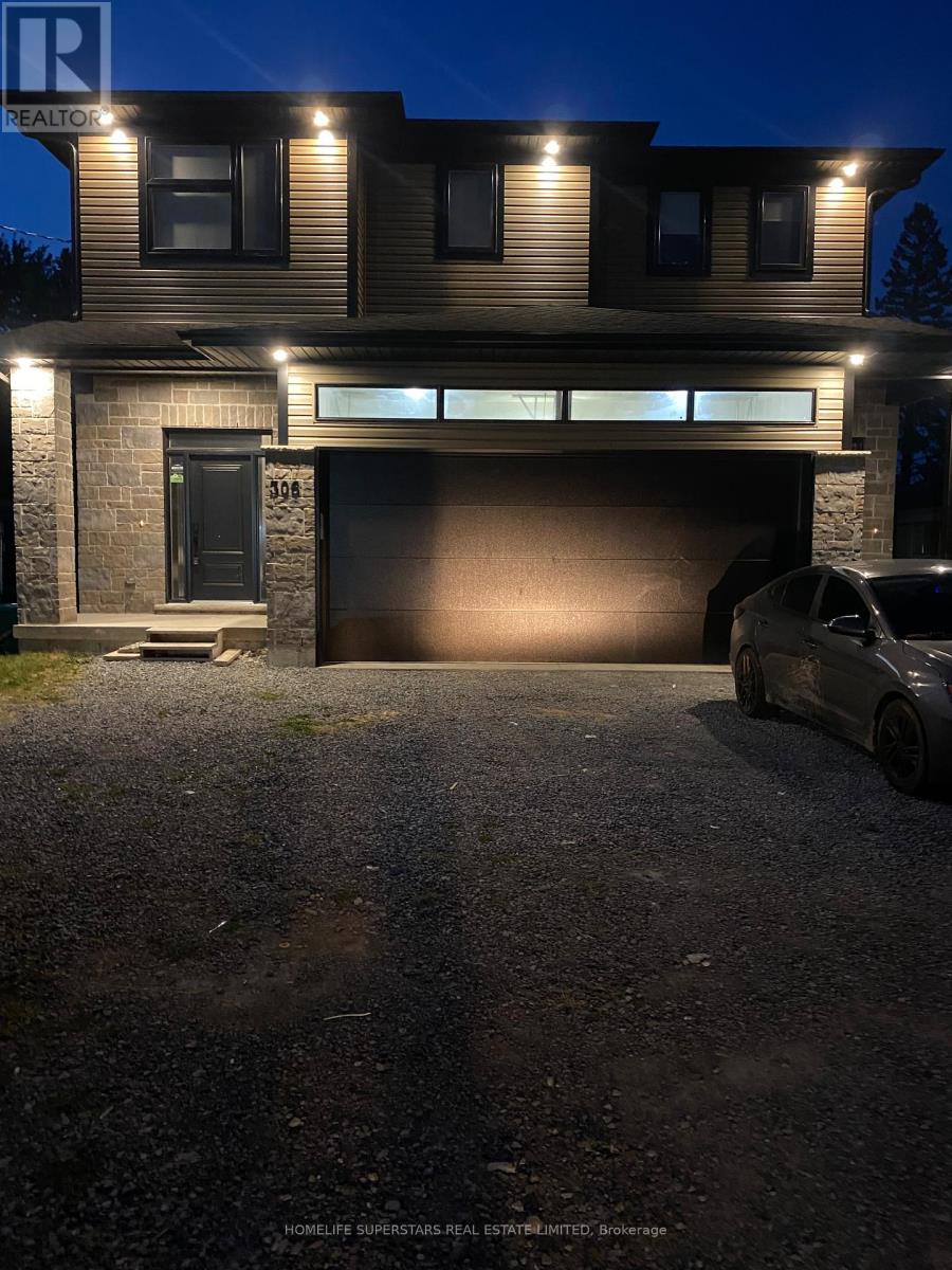 A house with a garage and a car parked in front.