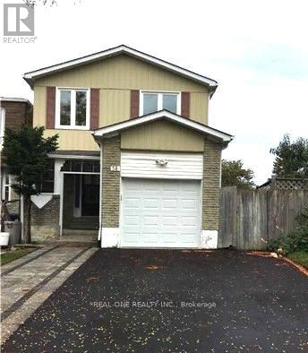 A two-story house with a garage is for sale.