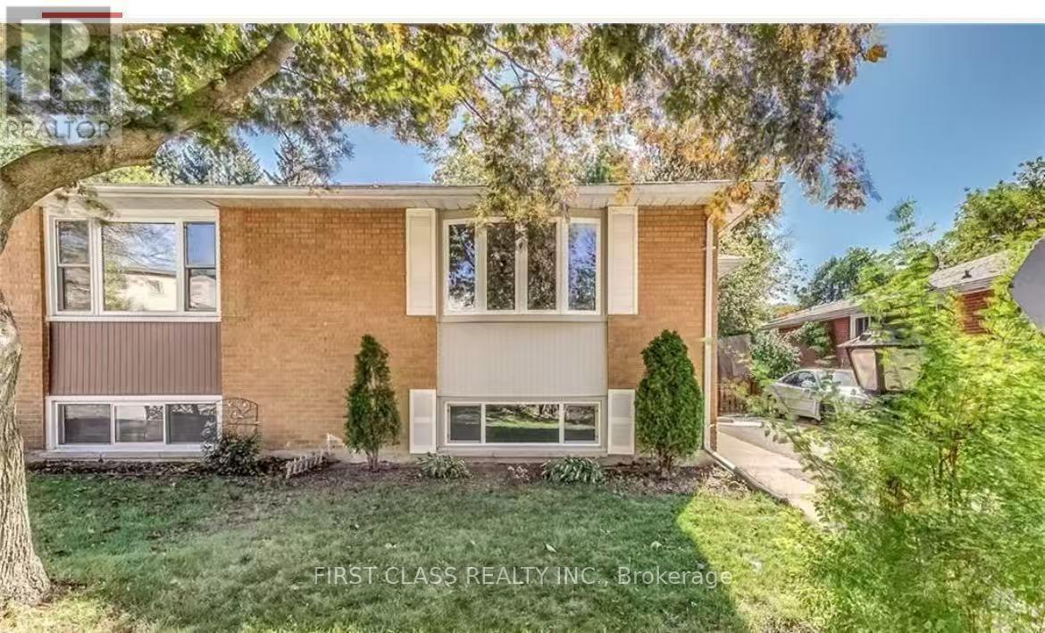 A house with a tree in front of it.