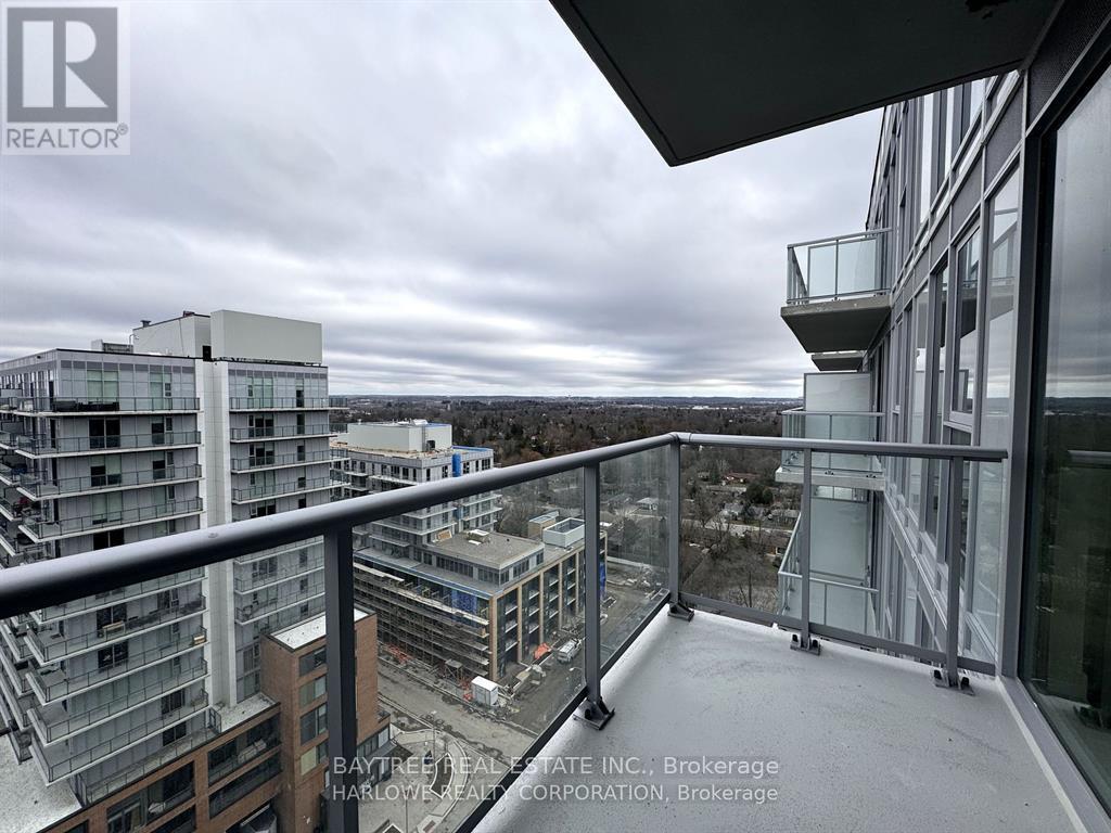 A balcony overlooks a construction site for a new building.