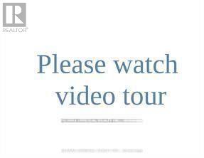 A sign asking to watch a video tour.