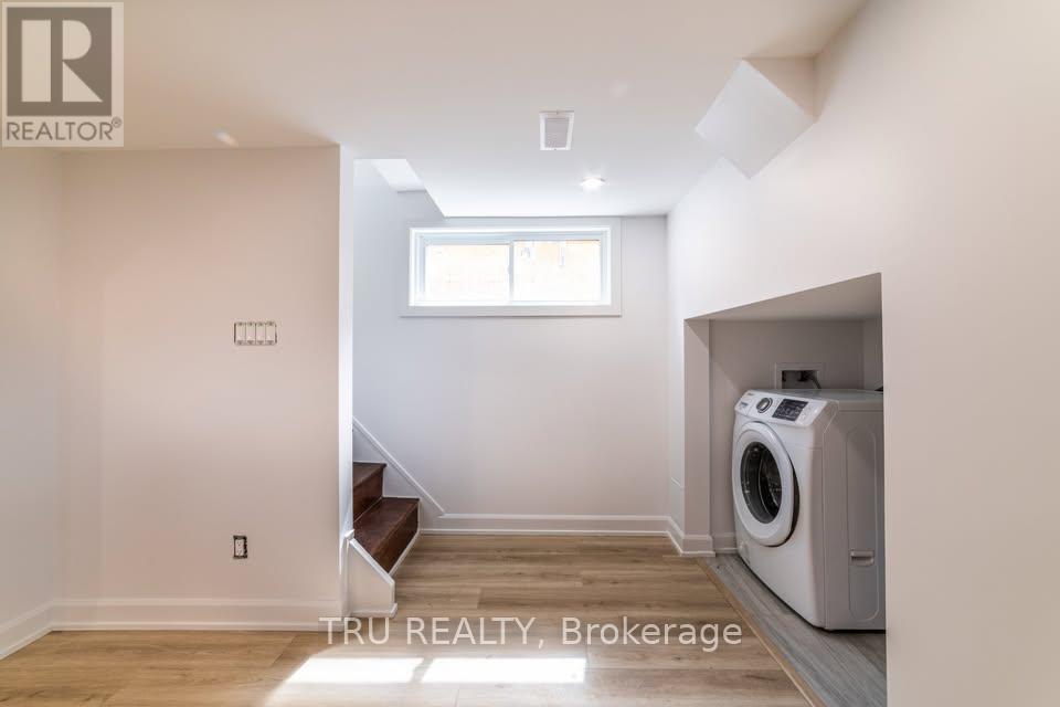 A room with a washing machine in it.