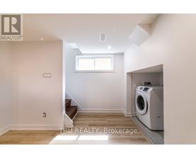A room with a washing machine in it.