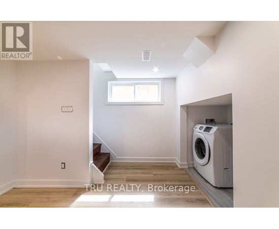 A room with a washing machine in it.