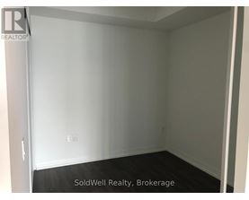 A room with white walls and a black floor.