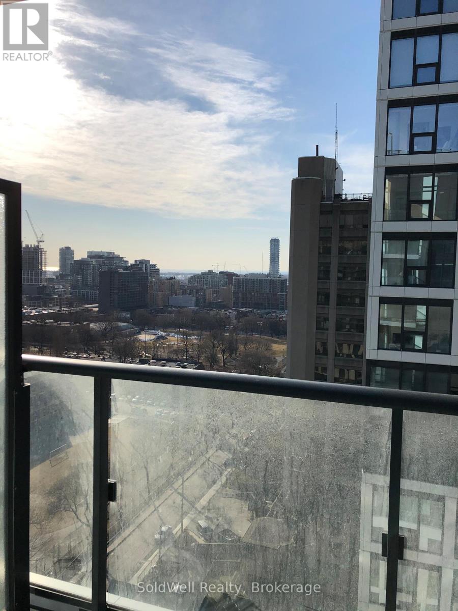 A view from a high-rise building looking out over a cityscape.