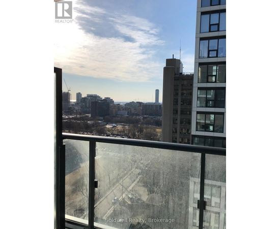 A view from a high-rise building looking out over a cityscape.